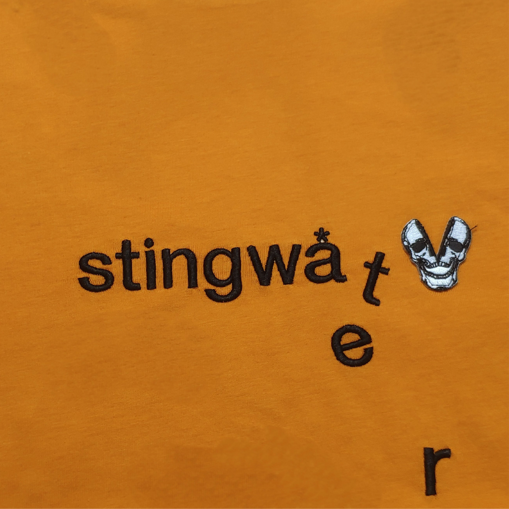 Classic melting logo and skull patch T Shirt Orange