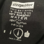 It stings the face T shirt black